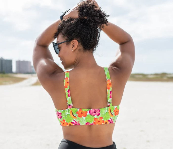 A woman enjoying the beach in SwimZip tankini top-How long does a tan last?