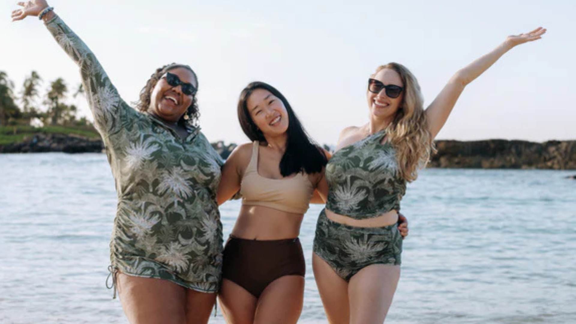 Women in SwimZip sun protective swimwear at the beach—Best swimsuits for pear body shapes (and what to avoid)