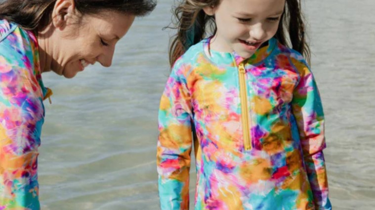 Mother and daughter in matching SwimZip swimwear by the lake—What is the best color swimsuit to wear in the lake?